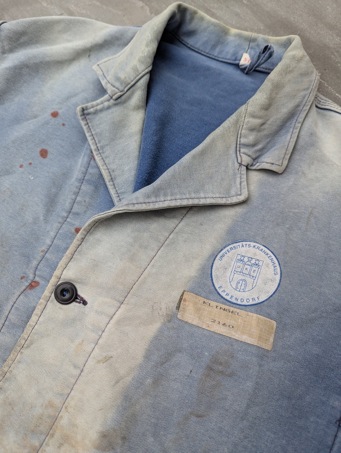 French faded and thrashed university jacket